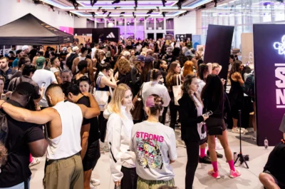 people gather on the expo floor at Strong New York