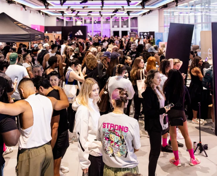 people gather on the expo floor at Strong New York