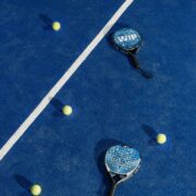 padel racquets and balls on court