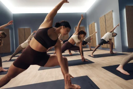 women do yoga in a Les Mills class