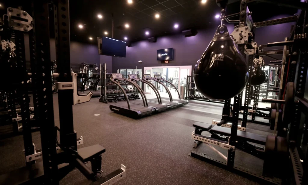 interior of a Styles Studios Fitness location with treadmills, power racks
