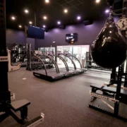 interior of a Styles Studios Fitness locations with treadmills, power racks