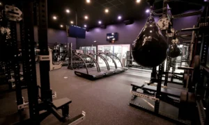 interior of a Styles Studios Fitness location with treadmills, power racks