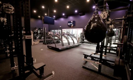 interior of a Styles Studios Fitness location with treadmills, power racks