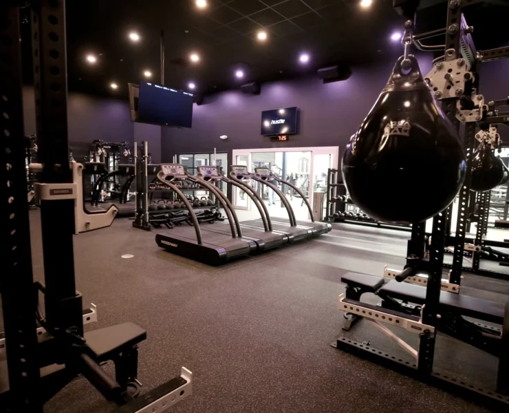 interior of a Styles Studios Fitness locations with treadmills, power racks