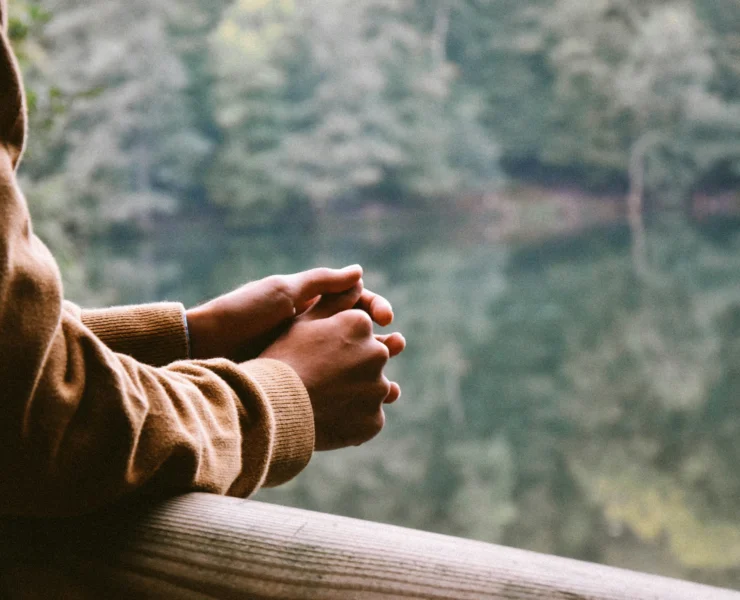 woman staring out into nature landscape