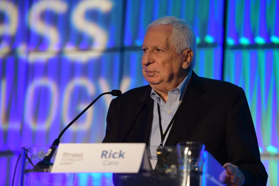 Rick Caro speaks on stage