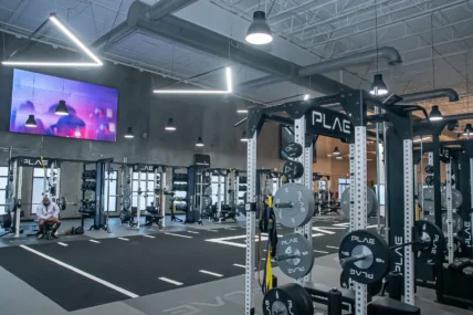 PLAE equipment and an LG tv inside a Fitness2020 gym