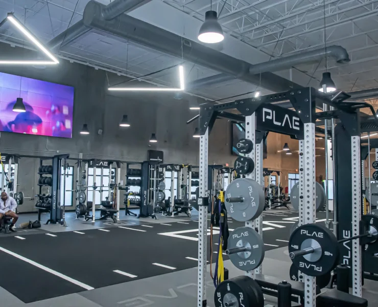 PLAE equipment and an LG tv inside a Fitness2020 gym