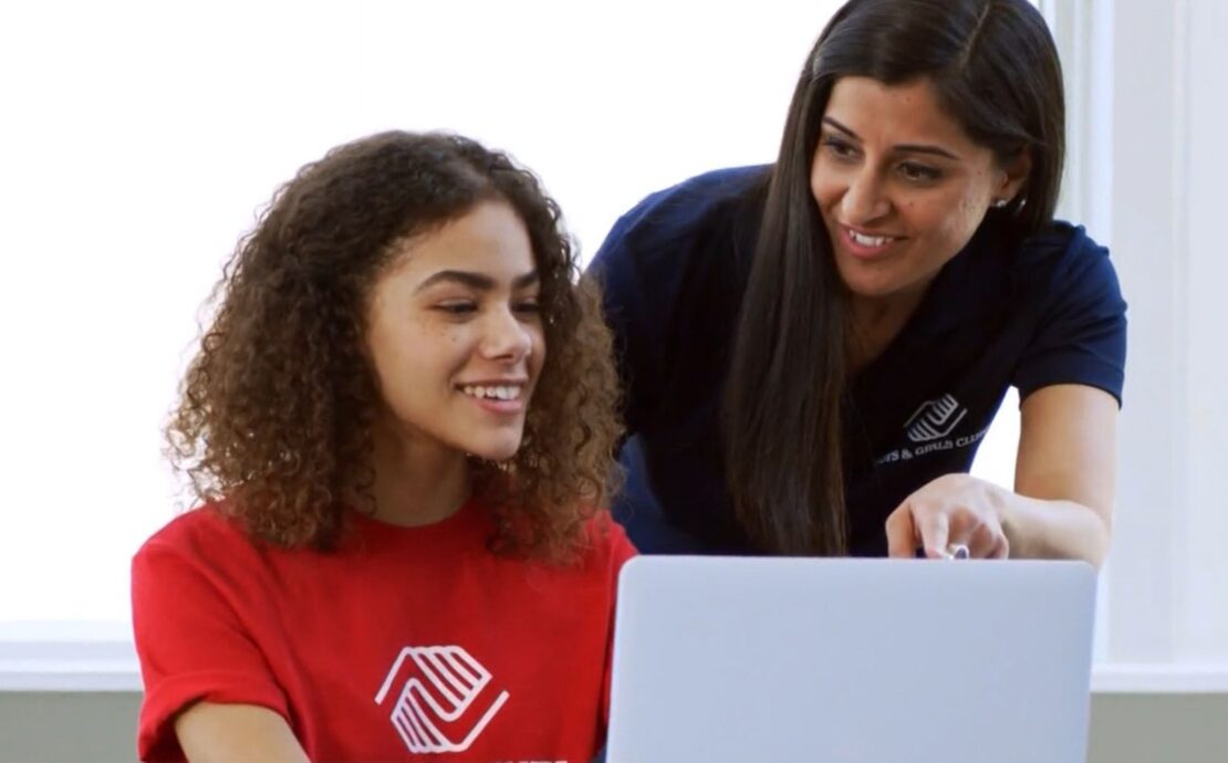 Boys & Girls Clubs member and staff memer on laptop