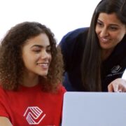 Boys & Girls Clubs member and staff memer on laptop