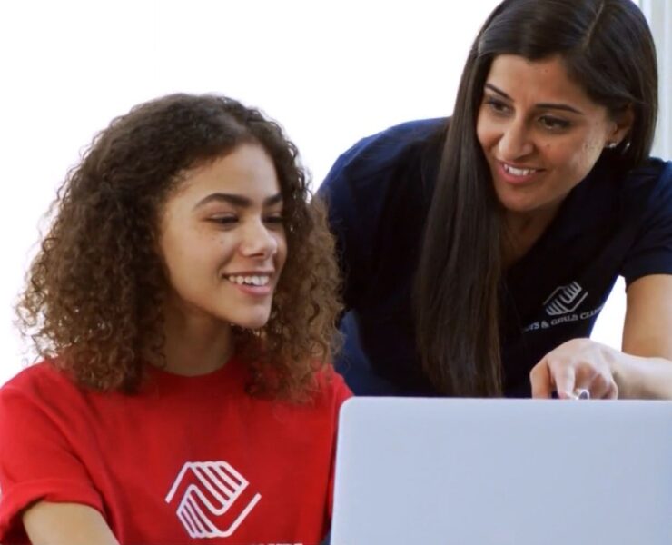 Boys & Girls Clubs member and staff memer on laptop