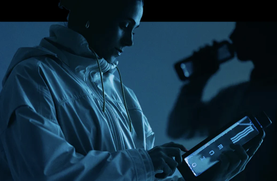 woman holds a water bottle