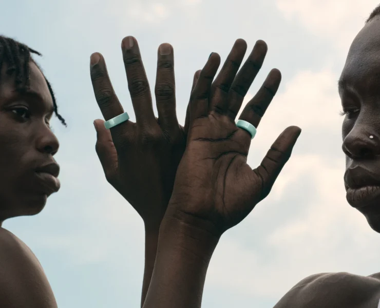 man and woman wear the ceramic Oura Ring 4