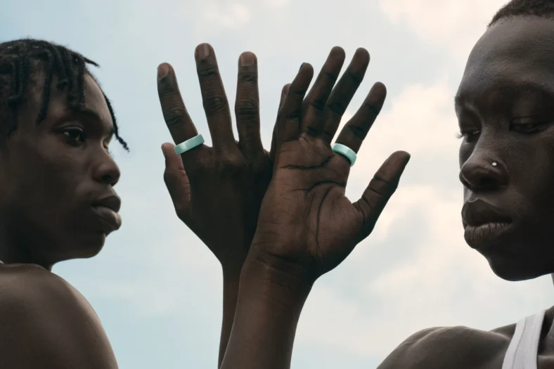 man and woman wear the ceramic Oura Ring 4