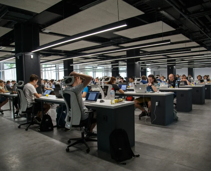 corporate office with employees sitting at desks