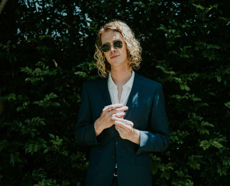 man in a suit wears a smart ring
