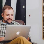 man types on Macbook