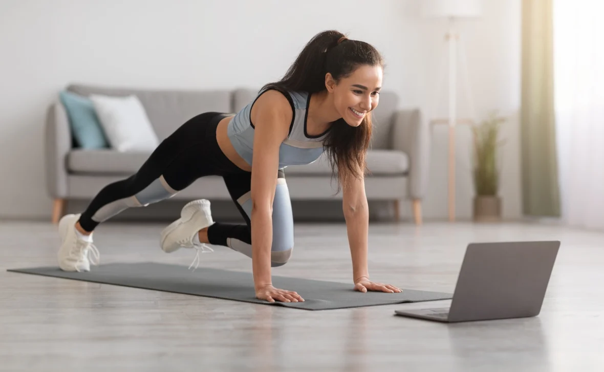 woman works out while streaming a fitness class