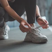 woman ties her sneaker