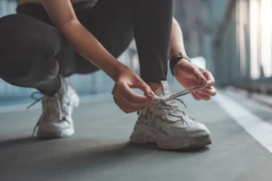 woman ties her sneaker
