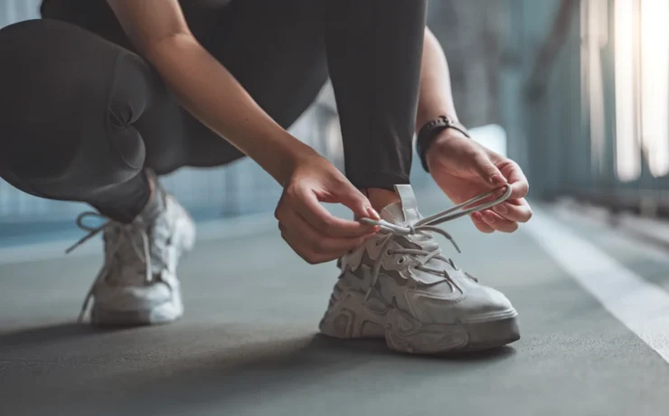 woman ties her sneaker