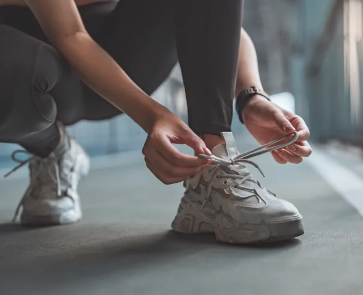 woman ties her sneaker