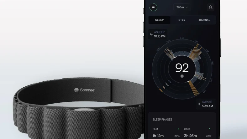 Somnee headband next to a smartphone