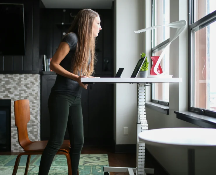 woman works at a standing desk
