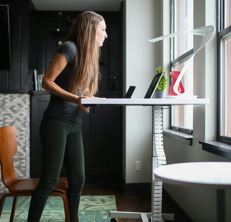 woman works at a standing desk