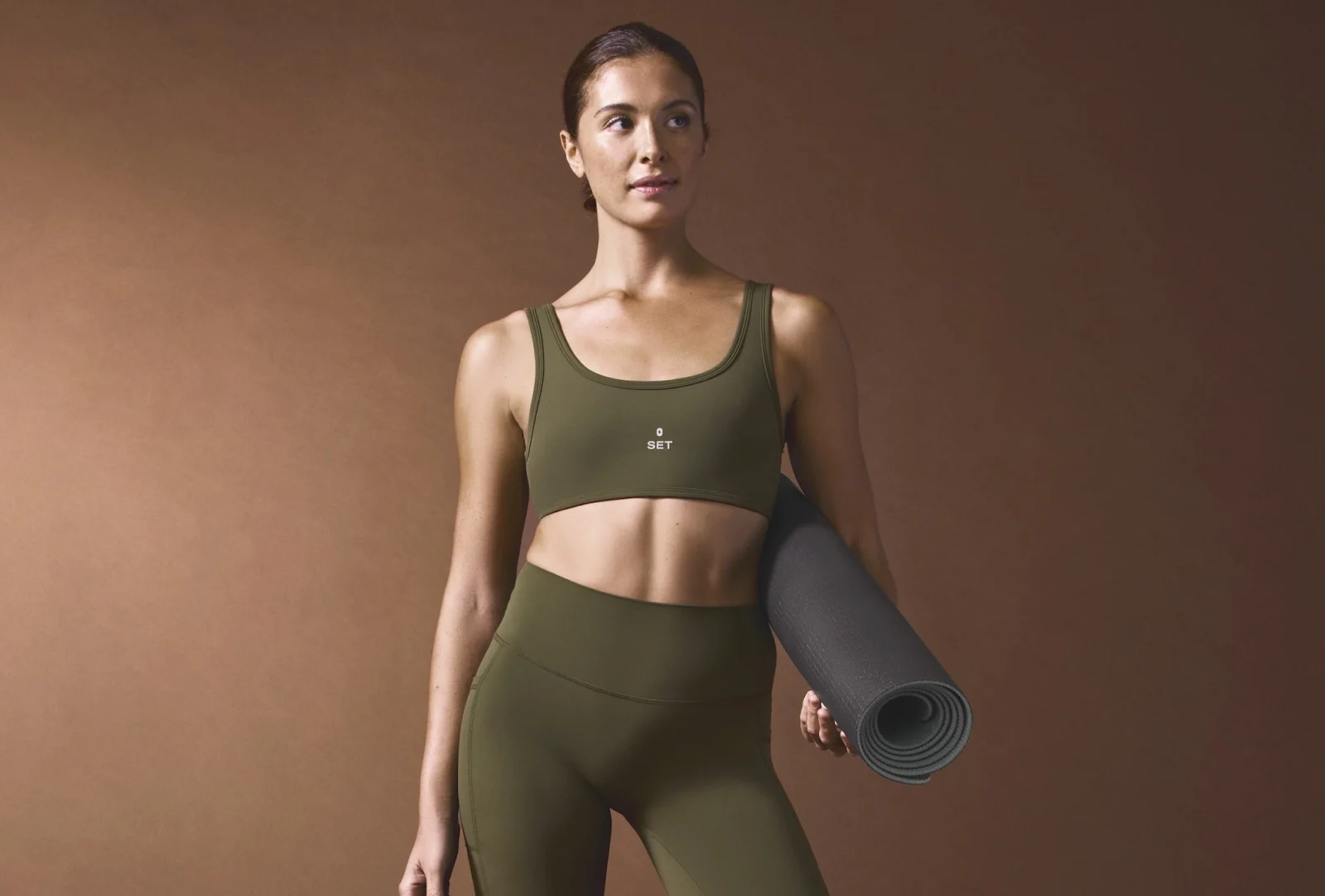 woman wears Figs x Set Active clothing