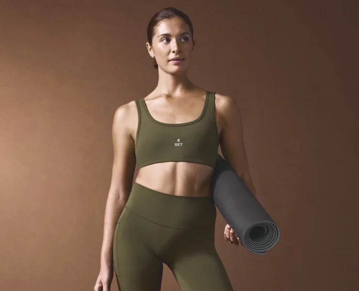 woman wears Figs x Set Active clothing
