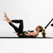 Kristin McGee does a Pilates workout on a Tonal machine