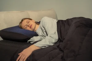 woman lays on an Eight Sleep pillow cover
