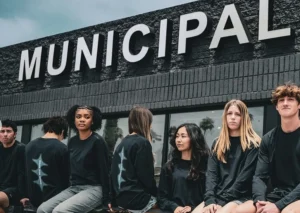people sit outside a Municipal storefront