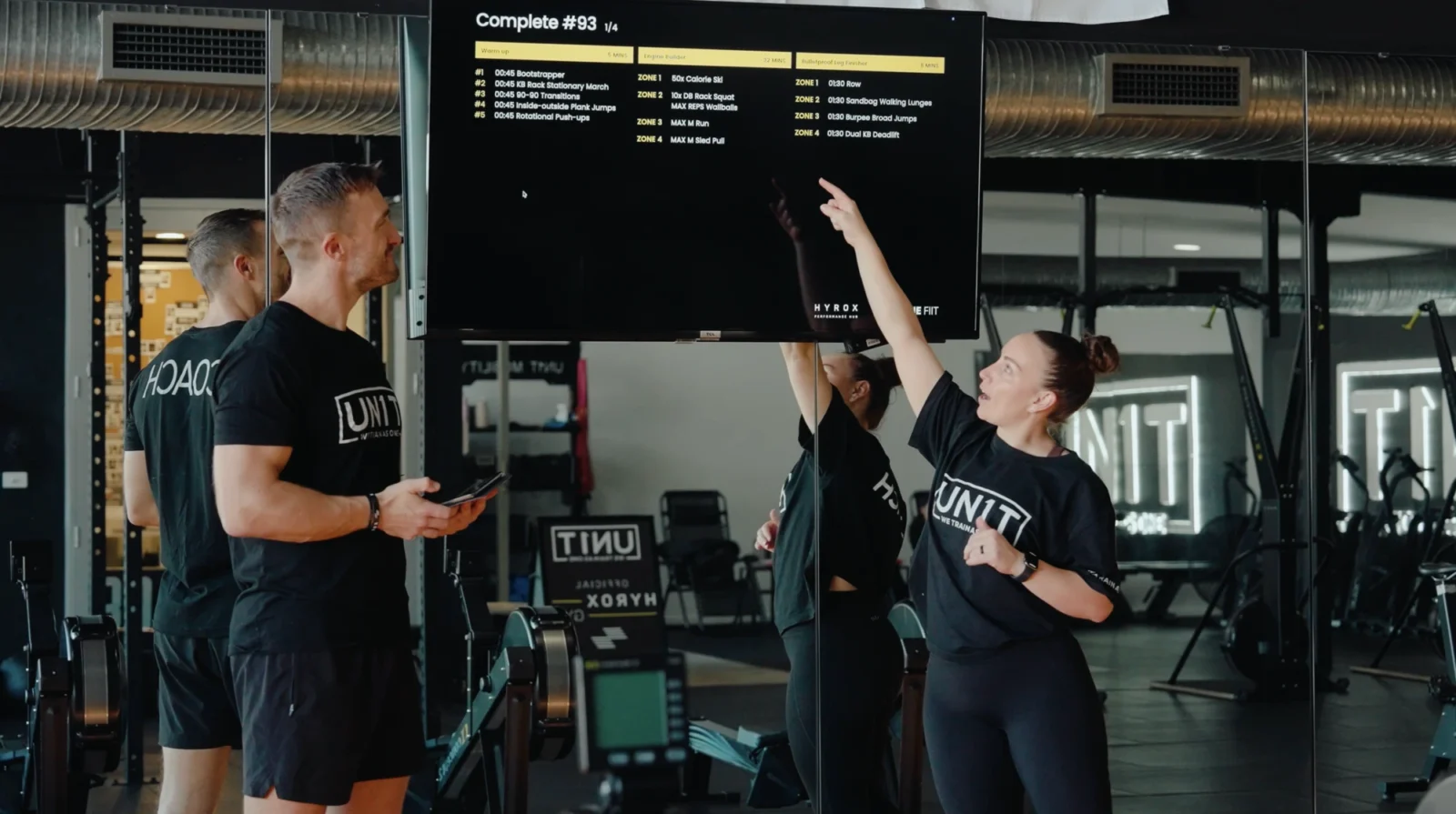 Hyrox coaches inside a gym