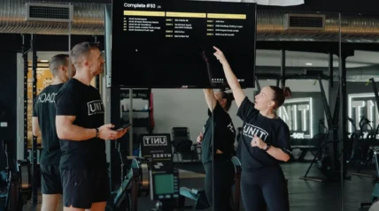 Hyrox coaches inside a gym