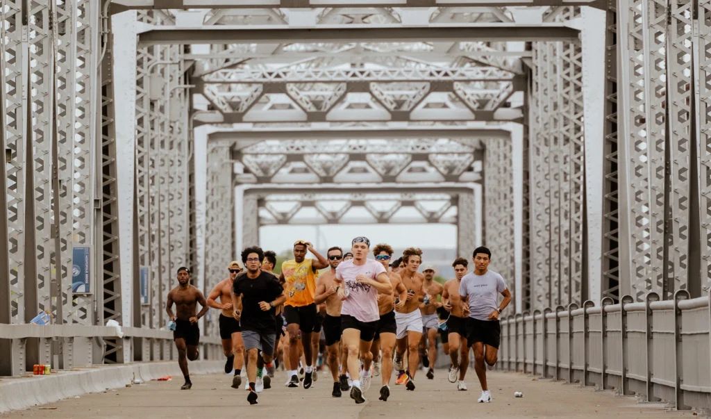 people run on a bridge in Austin, Texas
