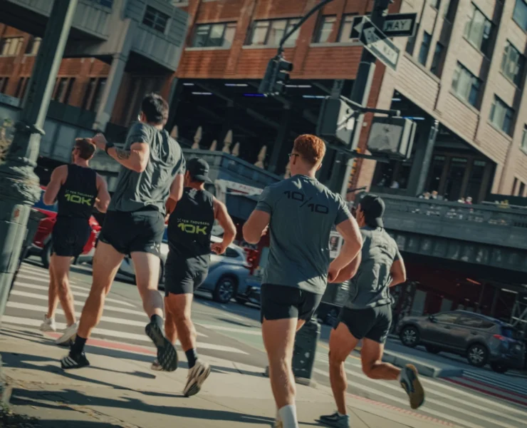 runners race through the streets of NYC