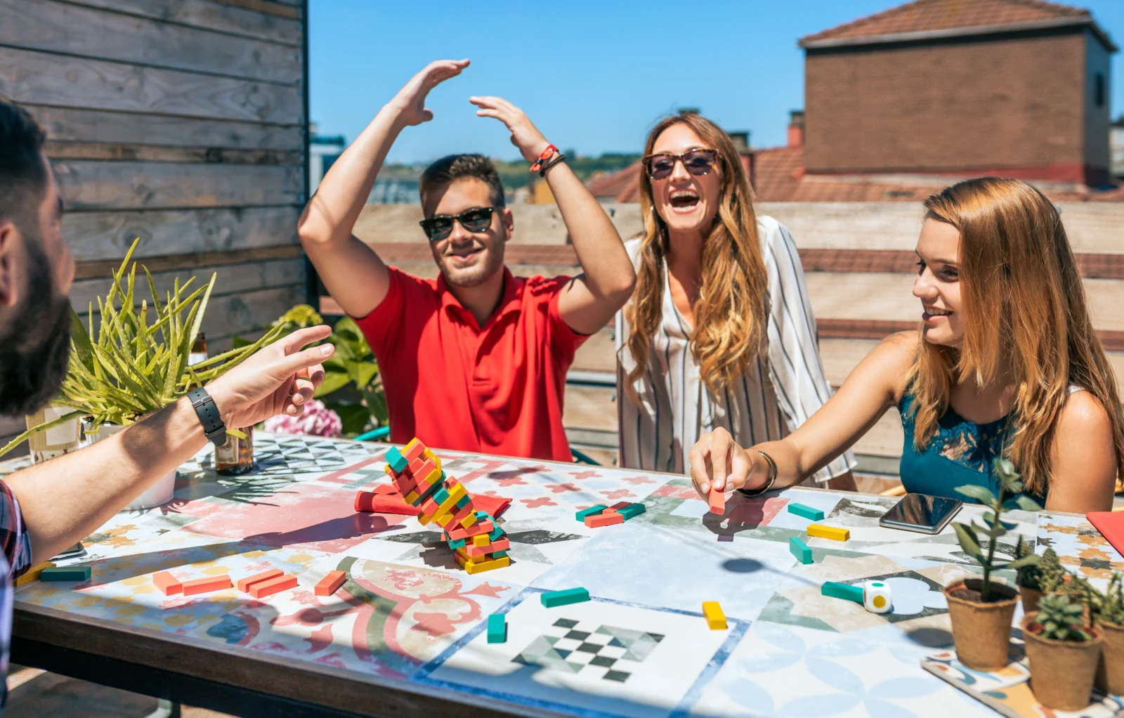 people play a puzzle game outside