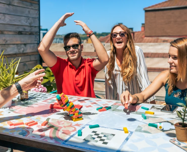 people play a puzzle game outside