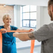 elderly woman works out with a personal trainer