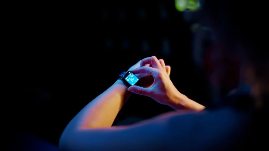 woman wears an Apple Watch using the Myzone app