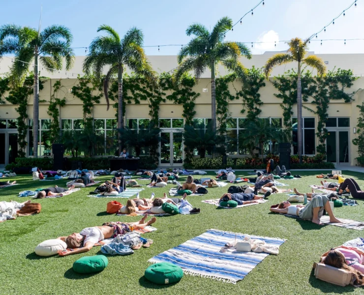 people do yoga outside at Eudemonia 2025