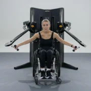 woman in a wheelchair works out with the new Life Fitness cable machine