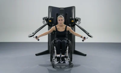 woman in a wheelchair works out with the new Life Fitness cable machine