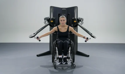 woman in a wheelchair works out with the new Life Fitness cable machine