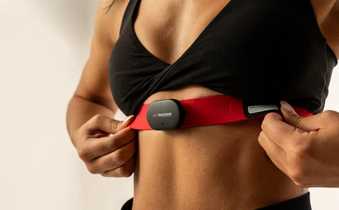 woman wears a Myzone wearable chest strap