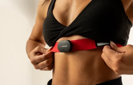 woman wears a Myzone wearable chest strap