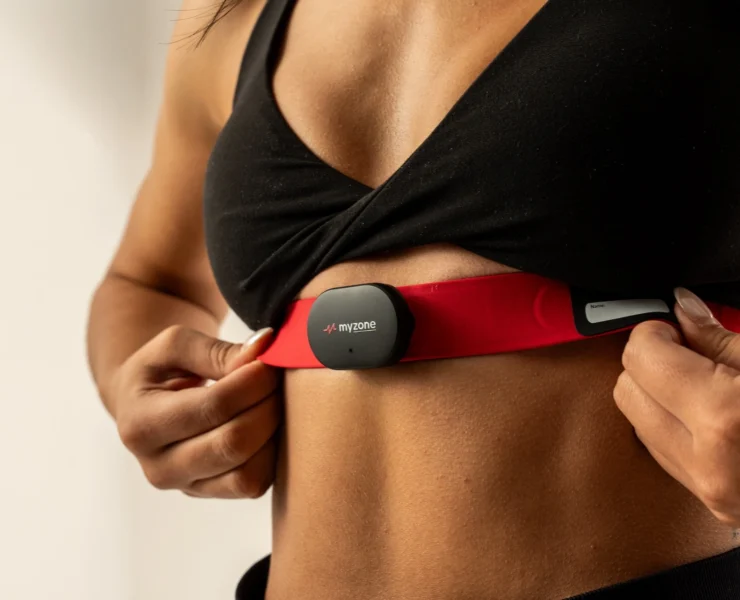 woman wears a Myzone wearable chest strap